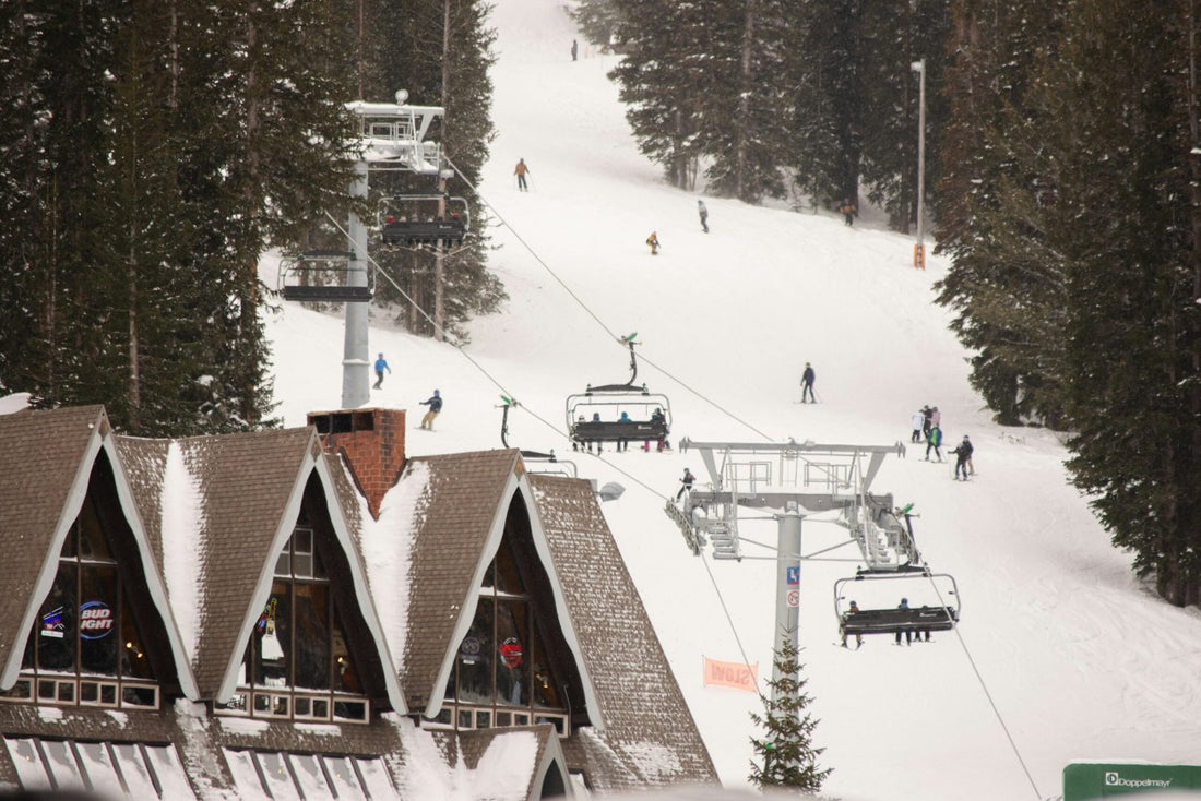 A ski lift going up the side of a mountain