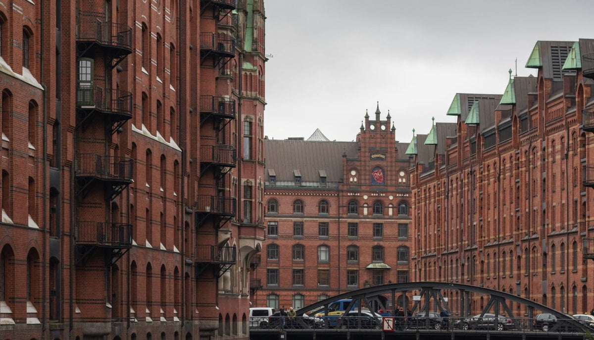 The red-brick warehouses of Hamburg's Speicherstadt with an iron bridge