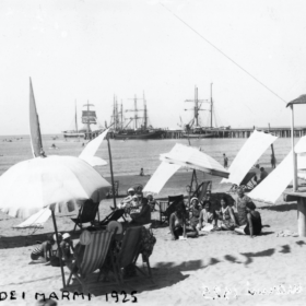 A vintage scenic view of Forte dei Marmi’s Roma Imperiale villas with La Capannina in the backdrop.
