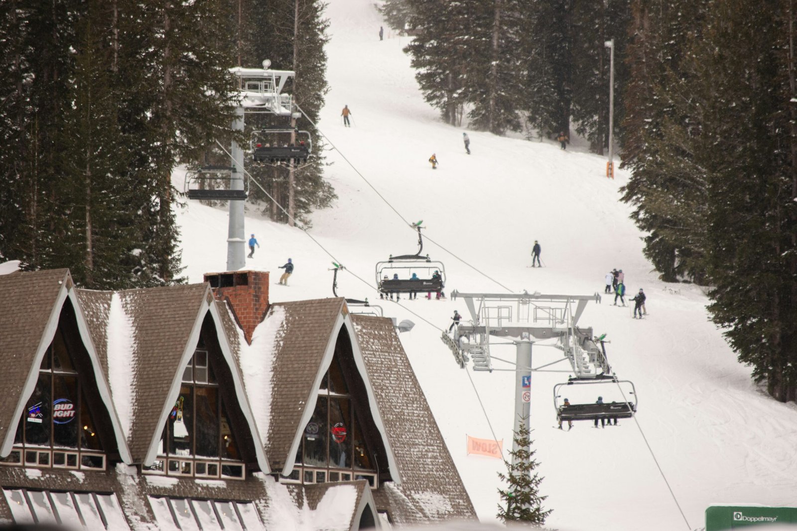 A ski lift going up the side of a mountain
